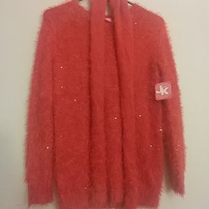 A red fuzzy sweater